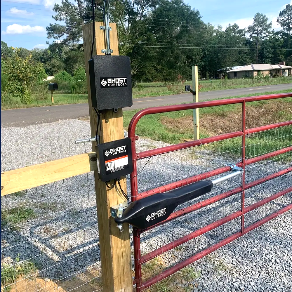 Ghost Controls single automatic gate opener on a red tube gate